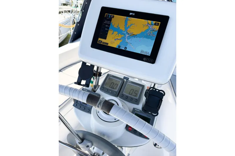 Slide: The Image of Steering console of a 2005 Hunter 36 sailboat with navigation display. - 22
