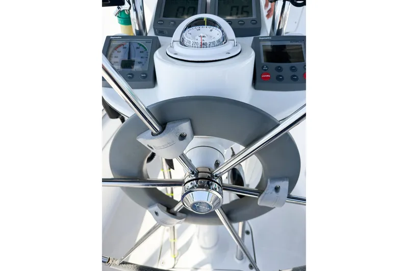 Slide: The Image of Steering wheel and navigation instruments on a 2005 Hunter 36 sailboat. - 24