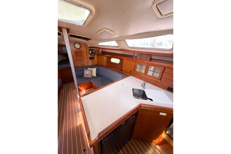 Slide: The Image of Interior of 2005 Hunter 36 sailboat with wood finish and compact kitchen area. - 35