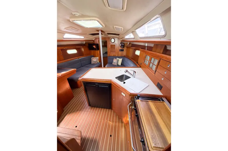 Slide: The Image of Interior of a 2005 Hunter 36 sailboat with wood finish and modern amenities. - 41