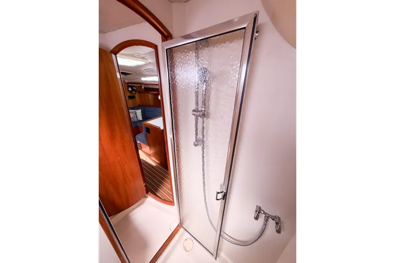 Slide: The Image of Shower area in 2005 Hunter 36 yacht with glass door and wooden interior. - 53
