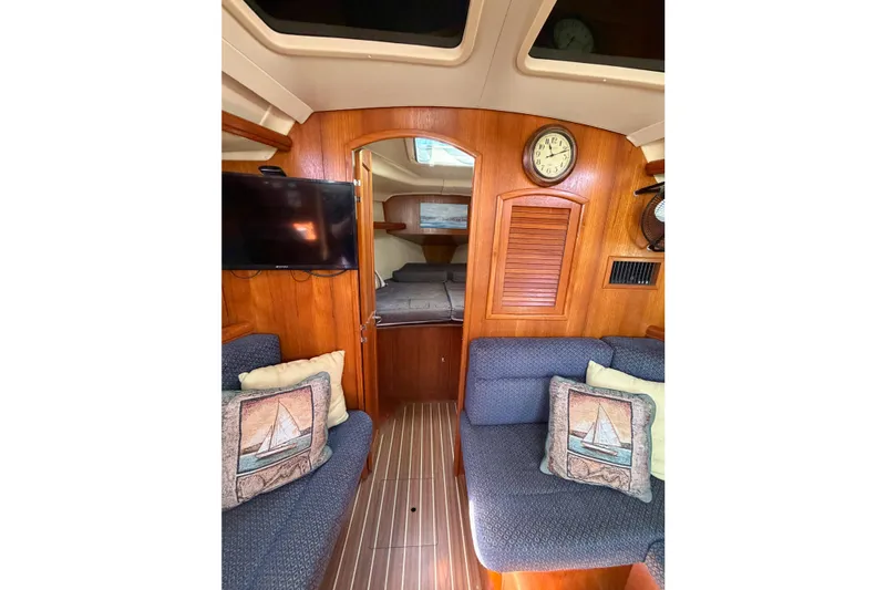 Slide: The Image of Interior of 2005 Hunter 36 sailboat with cozy seating and nautical decor. - 59
