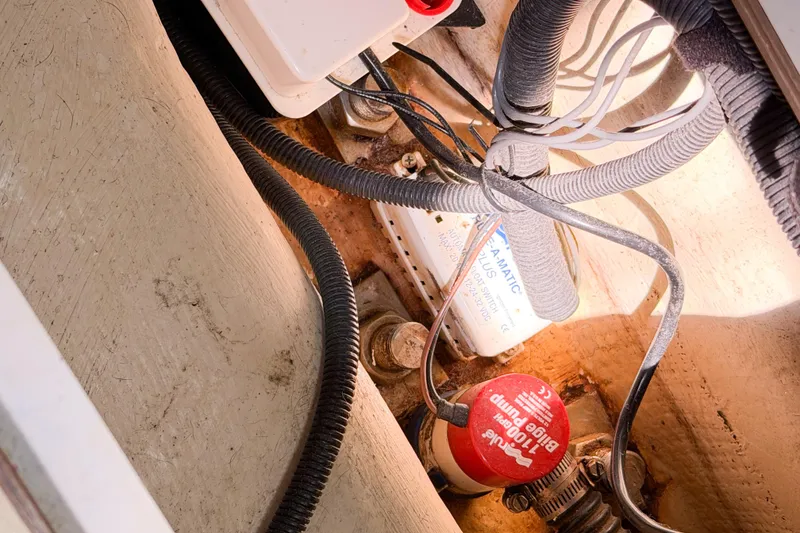 Slide: The Image of Bilge pump system in a 2005 Hunter 36 sailboat, featuring wiring and components. - 70