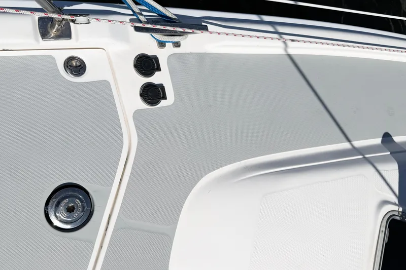 Slide: The Image of Deck of a 2005 Hunter 36 sailboat with fittings and textured surface. - 78