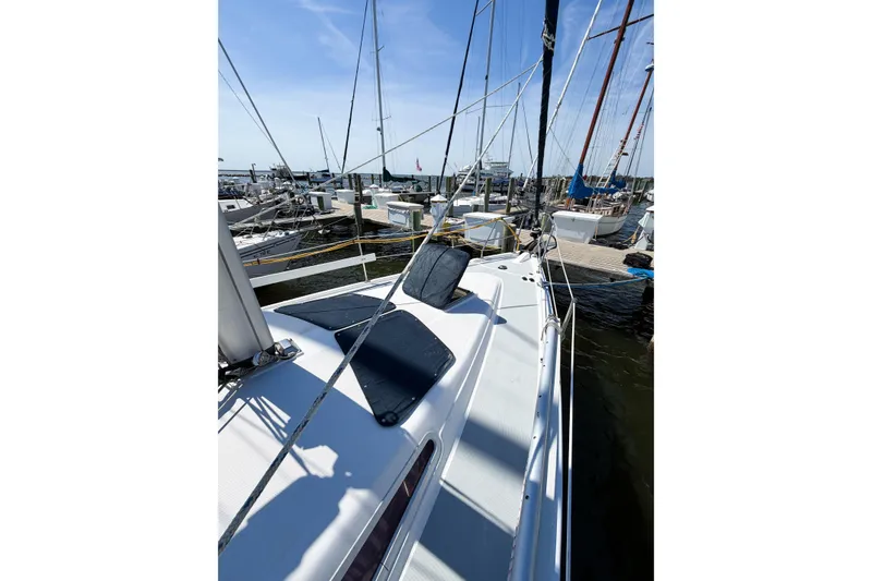 Slide: The Image of 2005 Hunter 36 sailboat docked at marina under clear blue sky. - 9