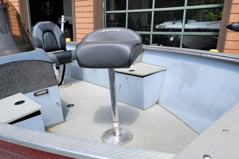 Slide: The Image of 2006 Lund 2000 Alaskan SS boat interior with seating and console. - 4