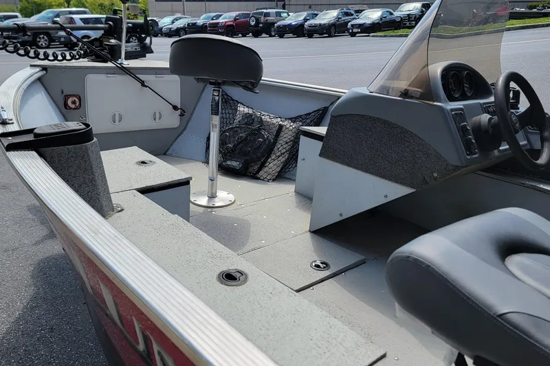 Slide: The Image of 2006 Lund 2000 Alaskan SS boat interior with steering console and seating. - 7
