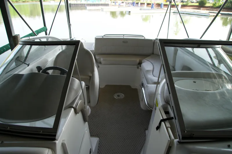Slide: The Image of 2008 Ebbtide 2460 Z-Trak SS DC FC boat interior with seating and steering wheel. - 10