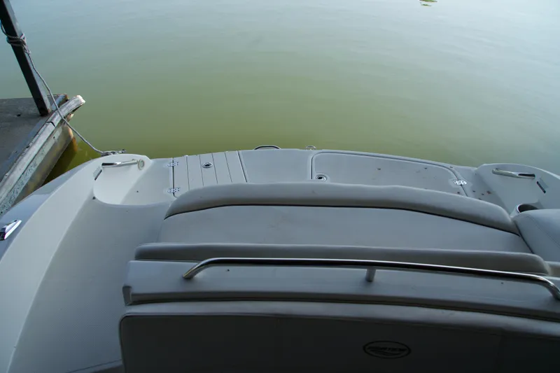 Slide: The Image of 2008 Ebbtide 2460 Z-Trak SS DC FC boat stern view at dock. - 13