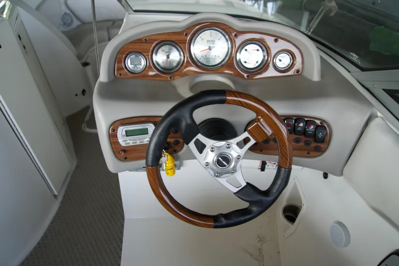 Slide: The Image of Steering wheel and dashboard of 2008 Ebbtide 2460 Z-Trak SS DC FC boat. - 15