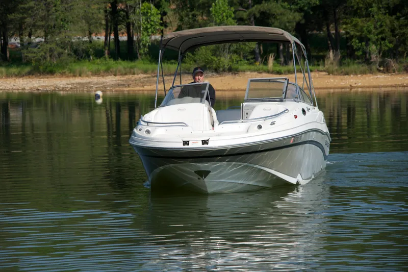 Slide: The Image of 2008 Ebbtide 2460 Z-Trak SS DC FC boat cruising on a calm lake. - 3