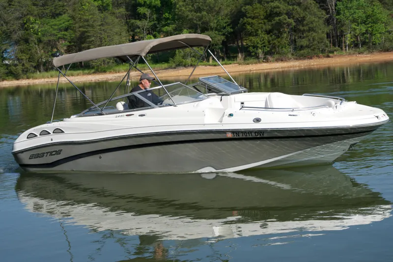 Slide: The Image of 2008 Ebbtide 2460 Z-Trak SS DC FC boat cruising on a calm lake. - 4