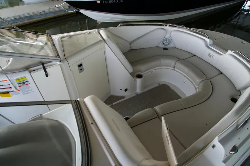 Slide: The Image of 2008 Ebbtide 2460 Z-Trak SS DC FC boat interior with spacious seating area. - 7