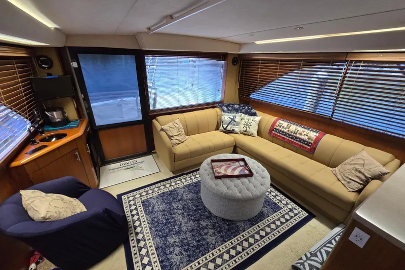 Slide: The Image of Luxurious interior of a 1993 Ocean Yachts 53 Super Sport with cozy seating and nautical decor. - 10