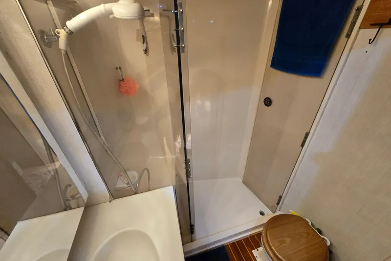Slide: The Image of Bathroom interior of 1993 Ocean Yachts 53 Super Sport with shower and toilet. - 19