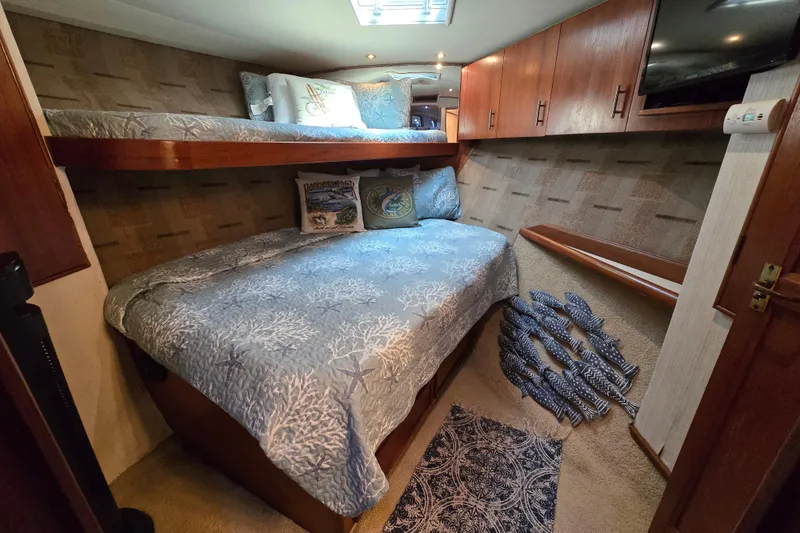 Slide: The Image of Luxurious cabin interior of 1993 Ocean Yachts 53 Super Sport with cozy bedding. - 20