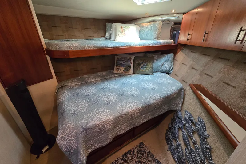 Slide: The Image of Interior cabin of 1993 Ocean Yachts 53 Super Sport with bunk beds and nautical decor. - 21