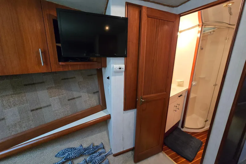 Slide: The Image of Interior of 1993 Ocean Yachts 53 Super Sport with TV and bathroom view. - 22