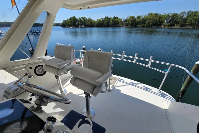 Slide: The Image of Cockpit view of 1993 Ocean Yachts 53 Super Sport on serene water. - 30
