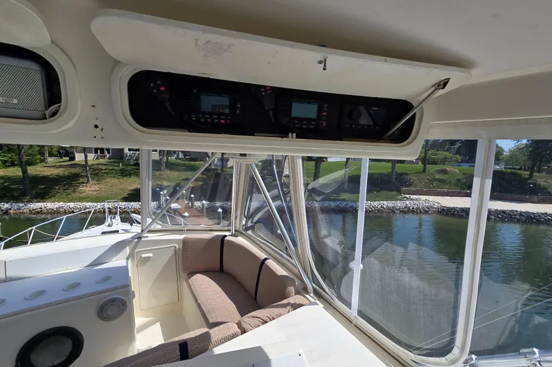 Slide: The Image of Interior view of 1993 Ocean Yachts 53 Super Sport, featuring helm and seating area. - 31