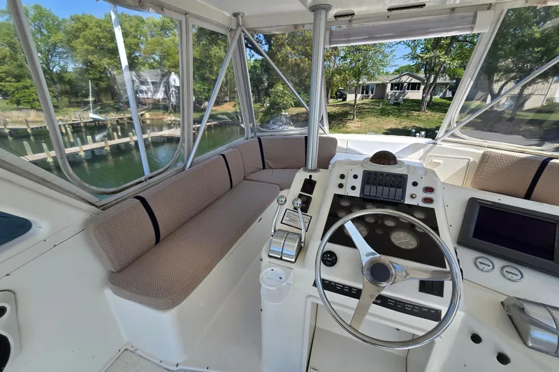 Slide: The Image of Cockpit of 1993 Ocean Yachts 53 Super Sport with steering wheel and seating. - 33