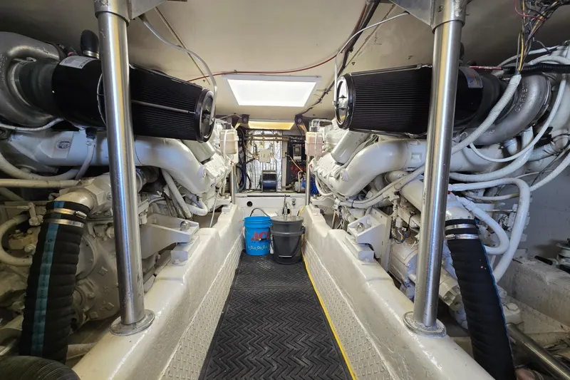 Slide: The Image of Engine room of a 1993 Ocean Yachts 53 Super Sport, showcasing dual engines and equipment. - 35