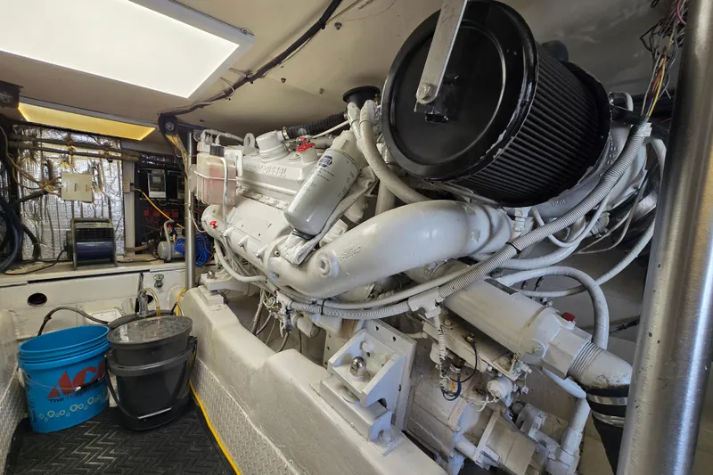 Slide: The Image of Engine room of a 1993 Ocean Yachts 53 Super Sport, showcasing mechanical components and equipment. - 36