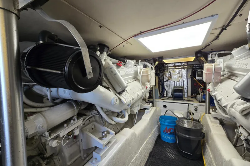 Slide: The Image of Engine room of a 1993 Ocean Yachts 53 Super Sport, featuring dual engines. - 37