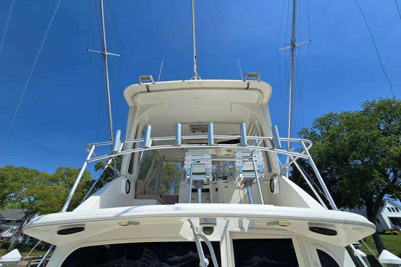 Slide: The Image of 1993 Ocean Yachts 53 Super Sport boat with flybridge against clear blue sky. - 42