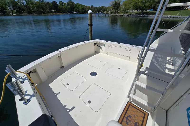 Slide: The Image of 1993 Ocean Yachts 53 Super Sport deck with water view and ladder. - 43