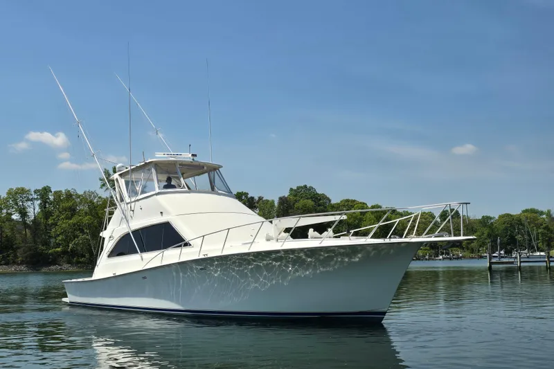 Slide: The Image of 1993 Ocean Yachts 53 Super Sport on calm water, clear sky background. - 5