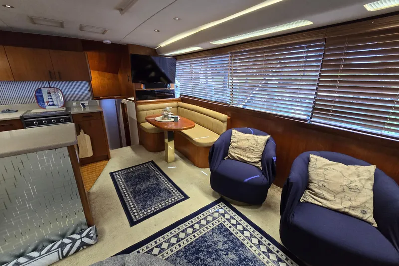Slide: The Image of Luxurious interior of 1993 Ocean Yachts 53 Super Sport with cozy seating and elegant decor. - 9
