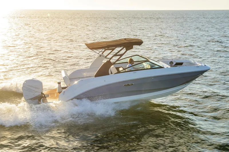 The Image of Manufacturer Provided Image: 2021 Sea Ray SDX 250 Outboard boat cruising on open water at sunset. - 0