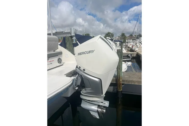 Slide: The Image of 2021 Sea Ray SDX 250 Outboard with Mercury engine at marina dock. - 12
