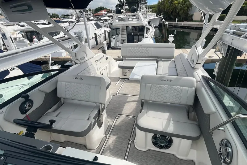 Slide: The Image of 2021 Sea Ray SDX 250 Outboard boat interior with luxurious seating and modern design. - 21