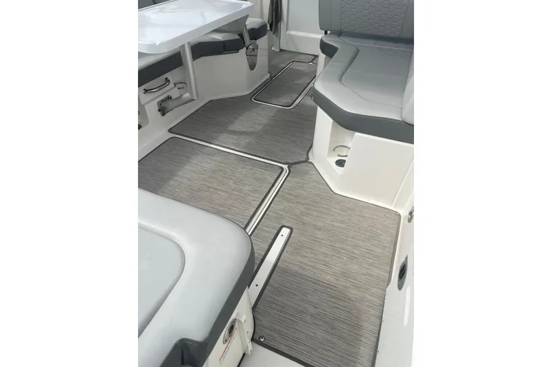 Slide: The Image of 2021 Sea Ray SDX 250 Outboard interior with gray seating and flooring. - 22