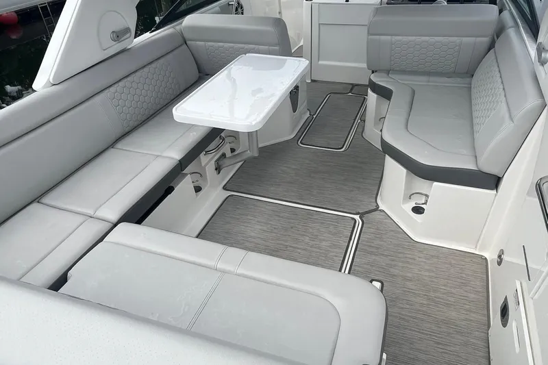 Slide: The Image of Luxurious seating area on a 2021 Sea Ray SDX 250 Outboard boat with sleek design. - 25