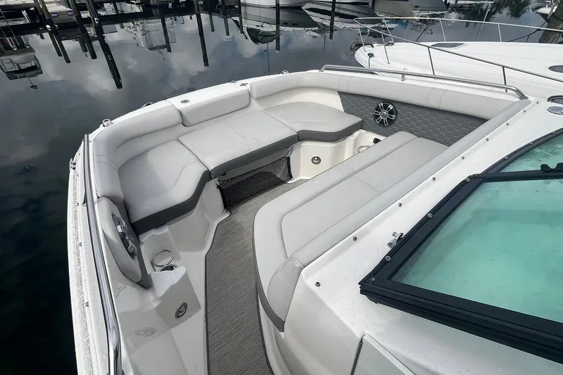 Slide: The Image of 2021 Sea Ray SDX 250 Outboard boat interior with spacious seating and modern design. - 30
