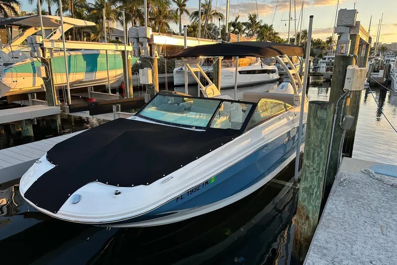Slide: The Image of 2021 Sea Ray SDX 250 Outboard boat docked at marina during sunset. - 8