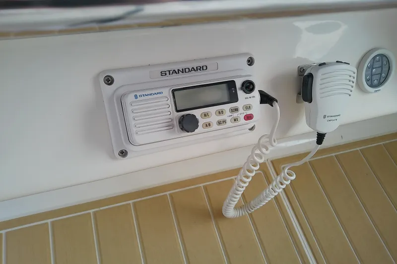 Slide: The Image of Marine radio system on a 1998 Sea Ray Sundancer 330 boat dashboard. - 18