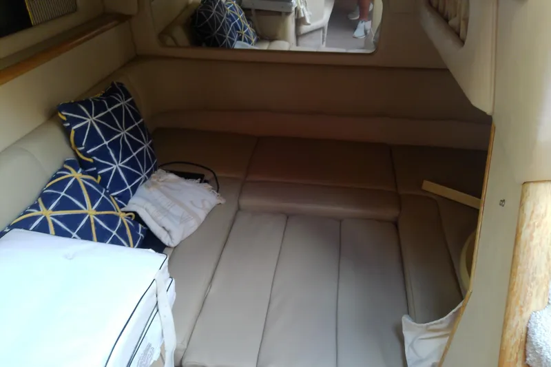 Slide: The Image of Interior cabin of 1998 Sea Ray Sundancer 330 with cushions and pillows. - 26