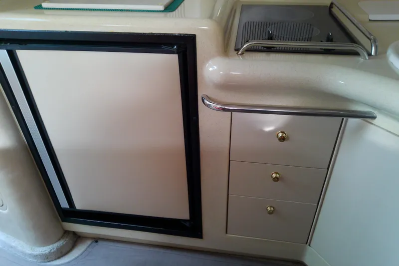 Slide: The Image of Interior of 1998 Sea Ray Sundancer 330 yacht kitchen with fridge and stove. - 33