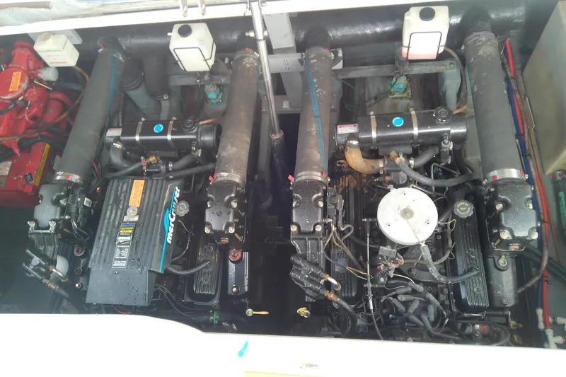 Slide: The Image of Engine compartment of a 1998 Sea Ray Sundancer 330, featuring dual MerCruiser engines. - 36