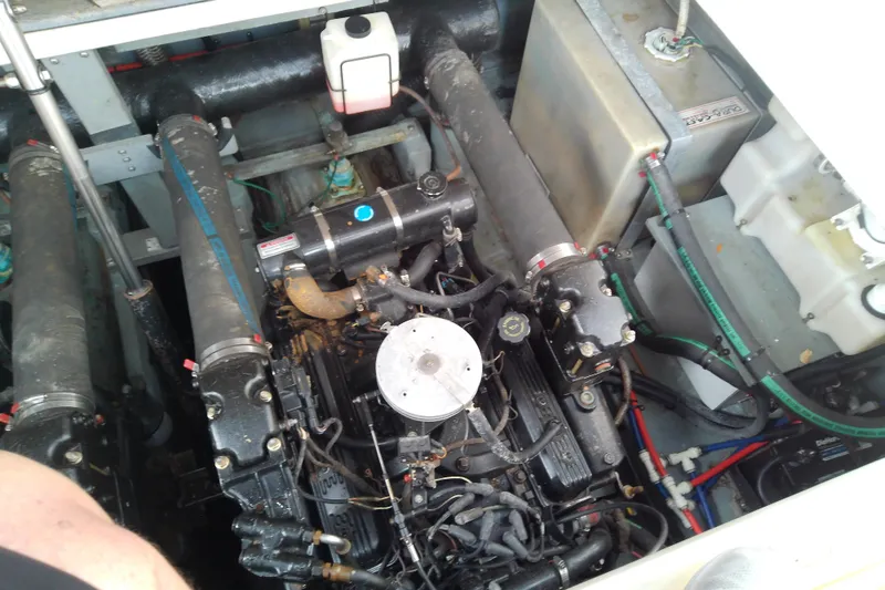 Slide: The Image of Engine compartment of a 1998 Sea Ray Sundancer 330 boat, showcasing mechanical components. - 39