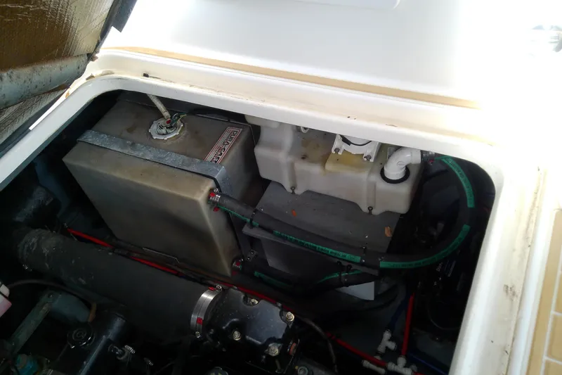 Slide: The Image of Engine compartment of a 1998 Sea Ray Sundancer 330, showing battery and wiring. - 40