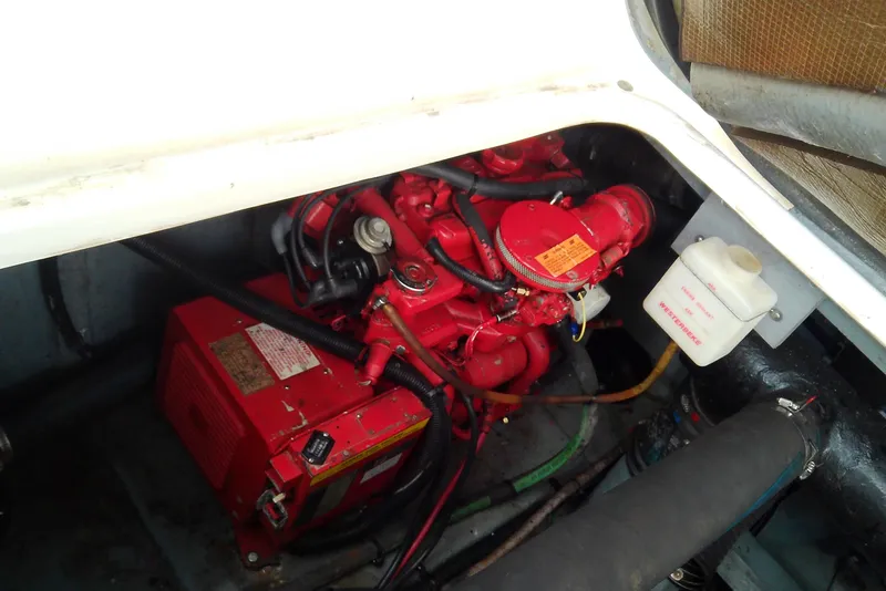 Slide: The Image of Engine compartment of a 1998 Sea Ray Sundancer 330 with red components and wiring. - 41