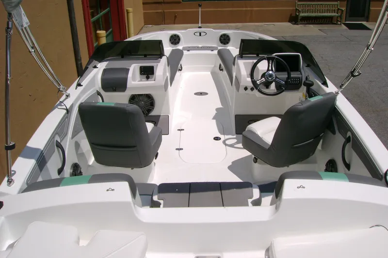 Slide: The Image of 2026 Tahoe T21 boat interior with modern seating and steering console. - 6