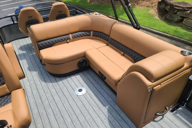 Slide: The Image of Luxurious tan seating on 2026 Ranger 223FC boat, featuring stylish design and comfortable upholstery. - 8