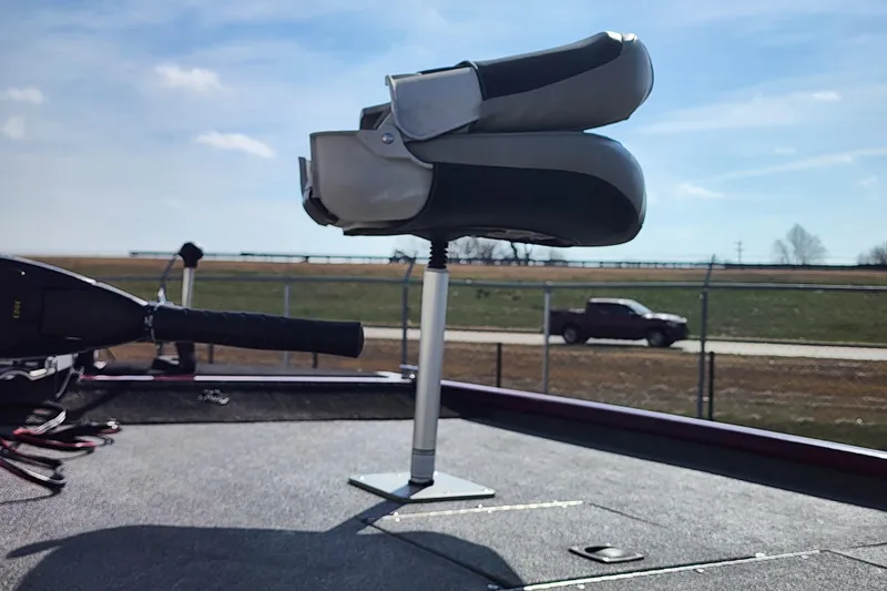 Slide: The Image of 2026 Tracker Pro 170 boat seat and steering, with a scenic outdoor backdrop. - 61