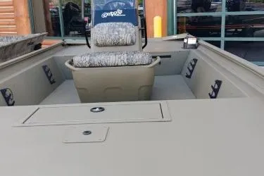 Slide: The Image of 2026 Tracker Grizzly 1860 CC boat interior with seating and storage compartments. - 7